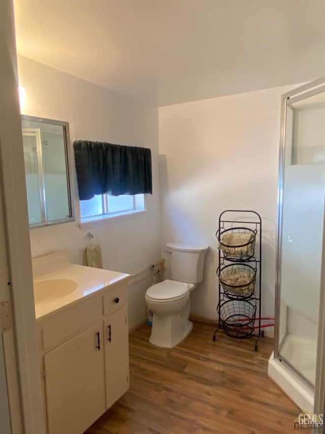 44212 Old Stage Rd, Posey, CA 93260 - bathroom with vanity, a shower stall, wood finished floors, and toilet