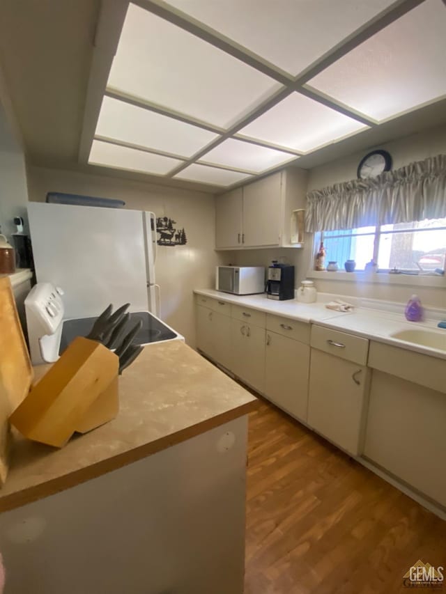 44212 Old Stage Rd, Posey, CA 93260 - kitchen with white appliances, wood finished floors, a sink, and wood counters