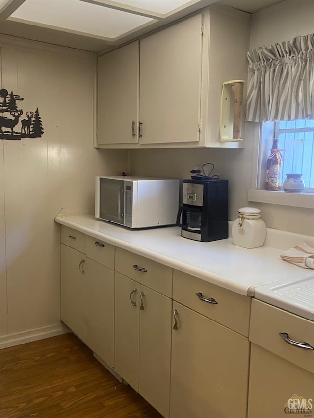 44212 Old Stage Rd, Posey, CA 93260 - kitchen with white microwave, dark wood-style floors, light countertops, and baseboards