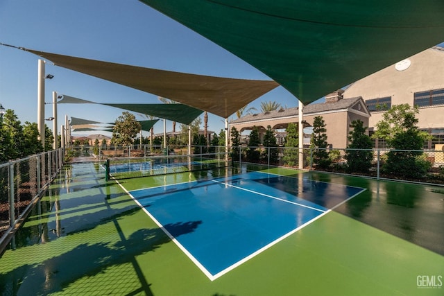 view of sport court featuring basketball hoop