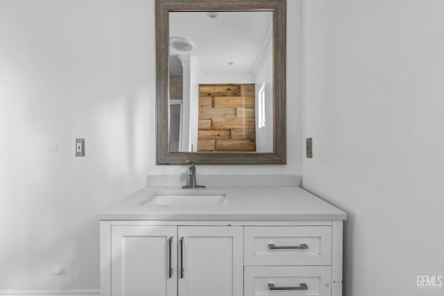 bathroom featuring vanity and crown molding