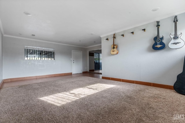 carpeted spare room with ornamental molding