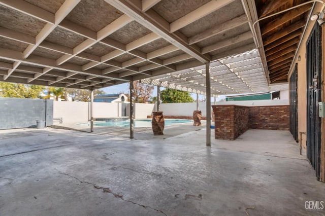 view of patio / terrace with a fenced in pool