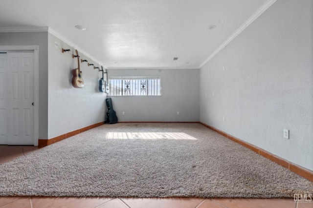 tiled spare room with crown molding