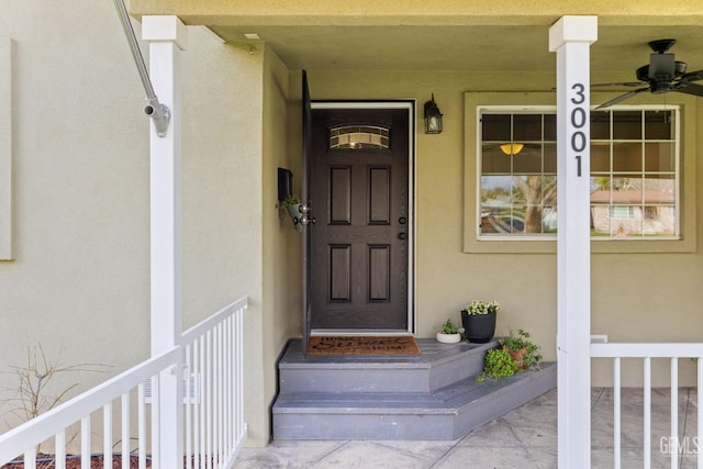 property entrance featuring stucco siding