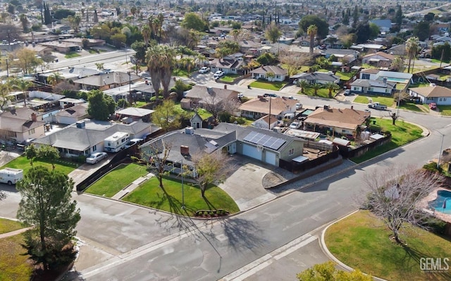 birds eye view of property with a residential view