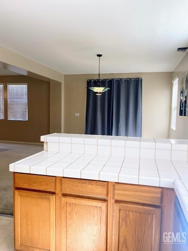 6622 Rimridge Way, Bakersfield, CA 93313 - kitchen with tile counters and hanging light fixtures