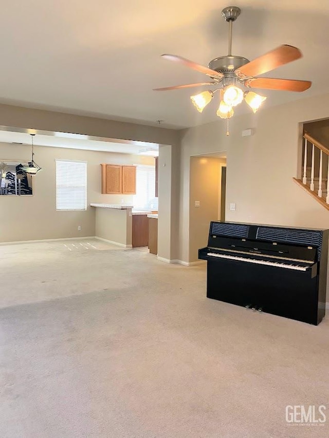 6622 Rimridge Way, Bakersfield, CA 93313 - unfurnished living room with a ceiling fan, light carpet, and plenty of natural light