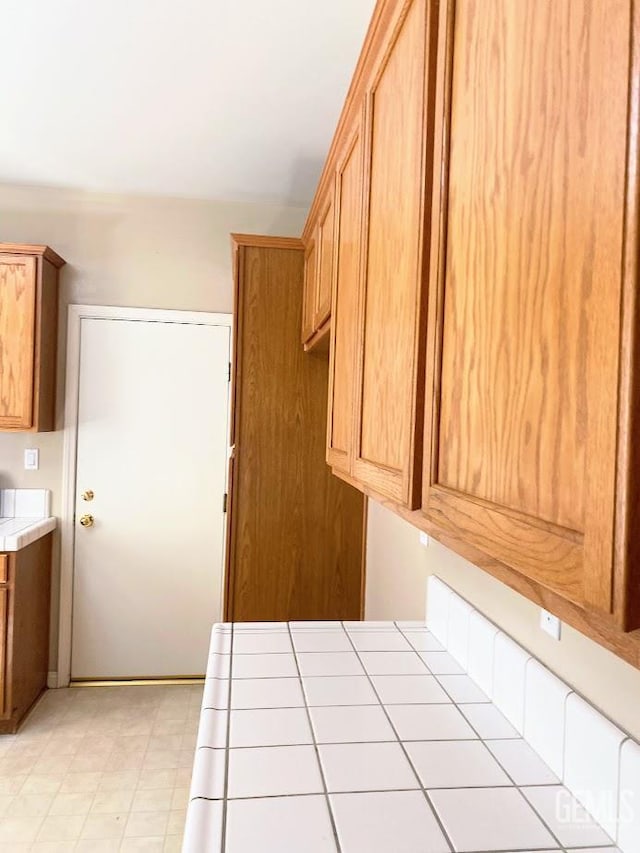 6622 Rimridge Way, Bakersfield, CA 93313 - kitchen featuring tile counters