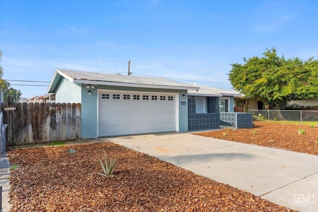 ranch-style home featuring a garage