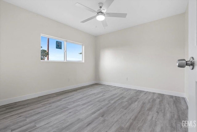 unfurnished room with ceiling fan and light hardwood / wood-style flooring