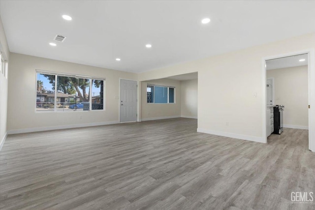 unfurnished living room featuring light hardwood / wood-style flooring