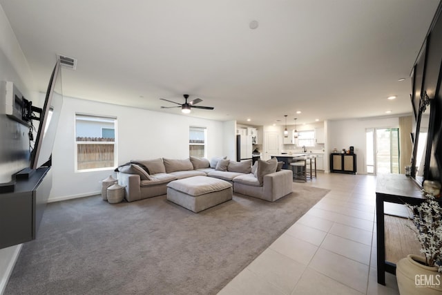 6028 Bogart Dr, Bakersfield, CA 93313 - living room featuring a ceiling fan, recessed lighting, light tile patterned flooring, and baseboards