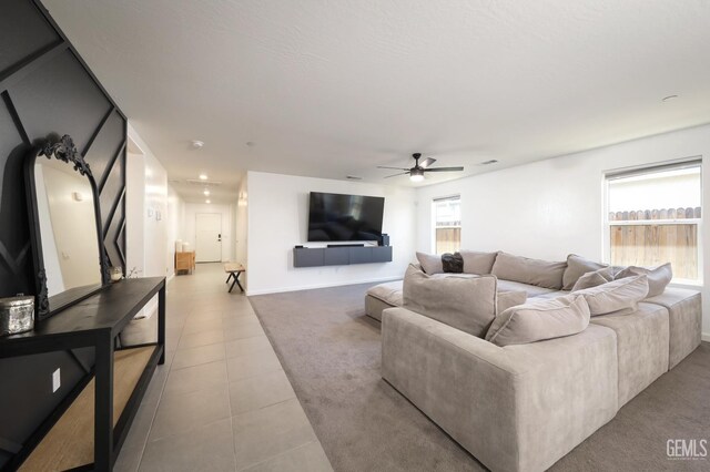 6028 Bogart Dr, Bakersfield, CA 93313 - living area with ceiling fan, tile patterned flooring, and baseboards
