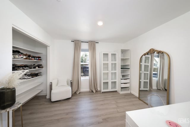 6028 Bogart Dr, Bakersfield, CA 93313 - sitting room with light wood-style floors and recessed lighting