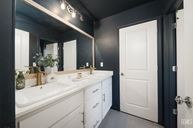 6028 Bogart Dr, Bakersfield, CA 93313 - full bath featuring tile patterned floors and double vanity