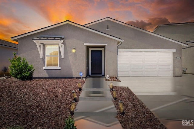 6028 Bogart Dr, Bakersfield, CA 93313 - single story home featuring stucco siding, an attached garage, and driveway