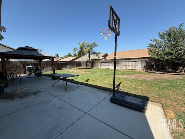 302 Quaking Aspen Ave, Wasco, CA 93280 - fenced backyard featuring a gazebo and a patio