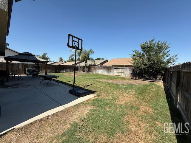 302 Quaking Aspen Ave, Wasco, CA 93280 - fenced backyard featuring a gazebo and a patio area