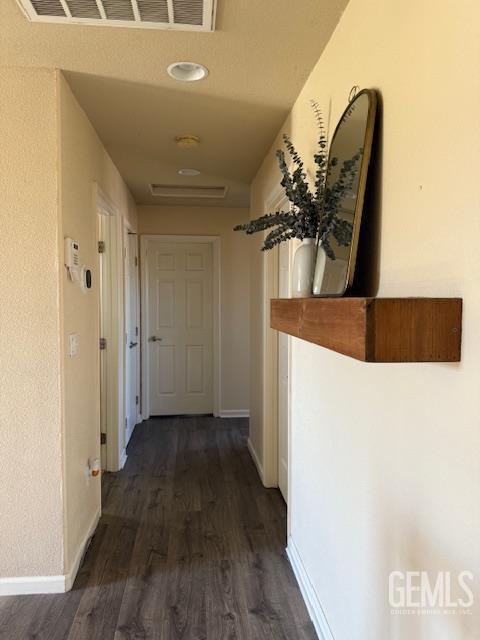 302 Quaking Aspen Ave, Wasco, CA 93280 - hall featuring dark wood-style flooring and baseboards