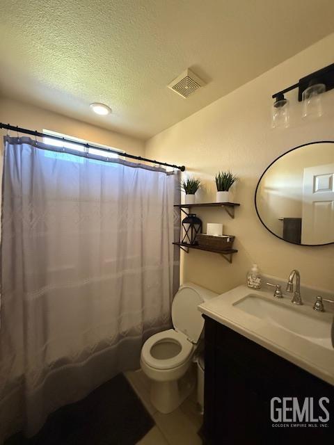 302 Quaking Aspen Ave, Wasco, CA 93280 - full bathroom with vanity, a textured ceiling, and a shower with curtain