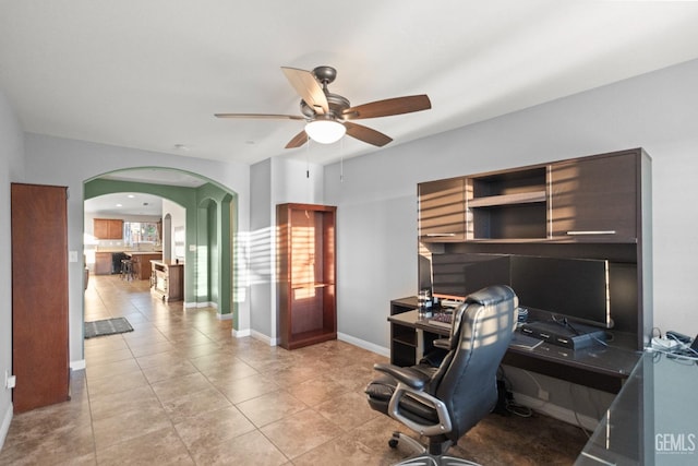 tiled office featuring ceiling fan