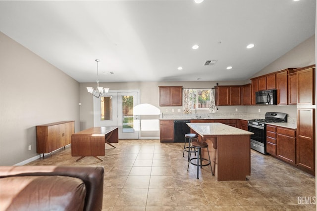 kitchen with a center island, hanging light fixtures, an inviting chandelier, a breakfast bar area, and black appliances