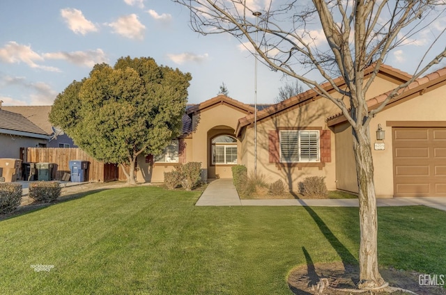 view of front of property with a front lawn and a garage