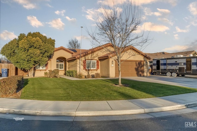 view of front facade featuring a garage and a front lawn