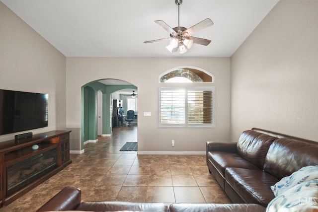 tiled living room with ceiling fan