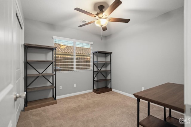 miscellaneous room with ceiling fan and light colored carpet