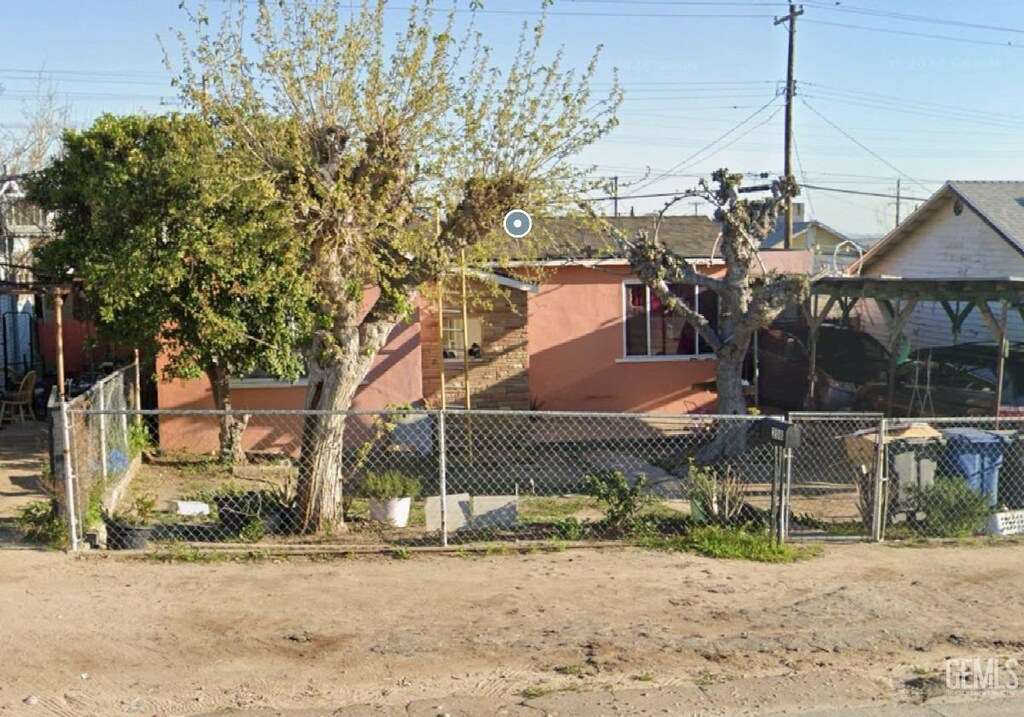 208 F St, Taft, CA 93268 - exterior space with fence, a gate, and stucco siding