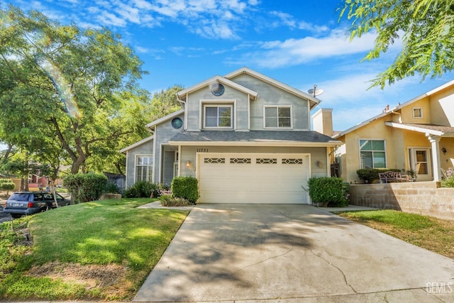 traditional home featuring driveway, an attached garage, and a front lawn