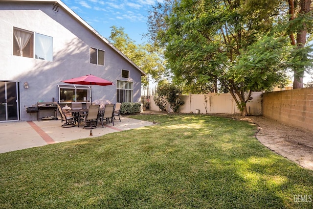 view of yard featuring a patio area and a fenced backyard