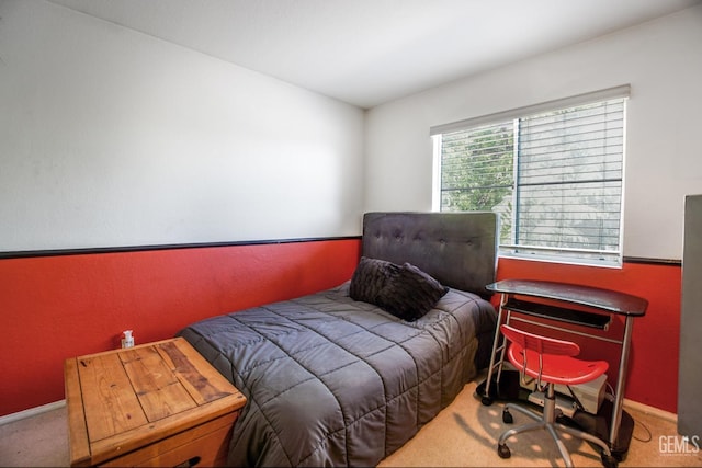 bedroom featuring baseboards and carpet flooring