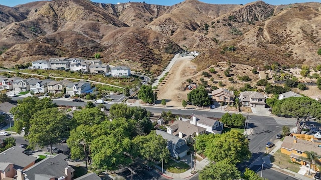 drone / aerial view with a residential view and a mountain view