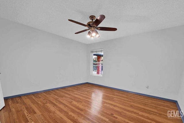 unfurnished room with a textured ceiling, ceiling fan, and light hardwood / wood-style flooring