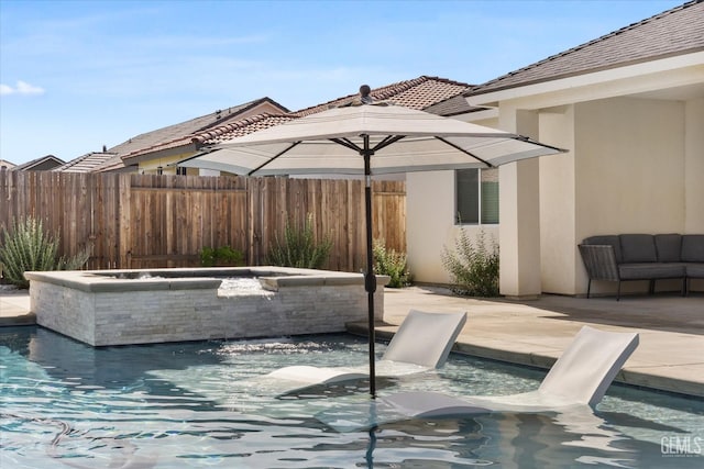 view of swimming pool with a jacuzzi, fence, a diving board, a fenced in pool, and a patio