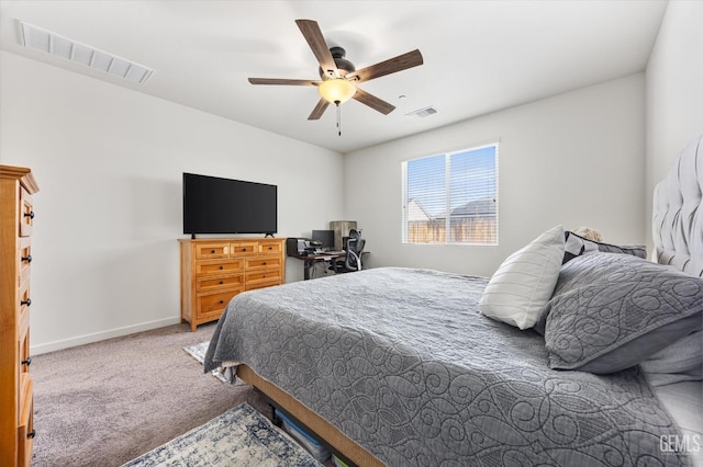 bedroom with baseboards, a ceiling fan, visible vents, and carpet
