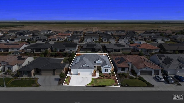 birds eye view of property with a residential view