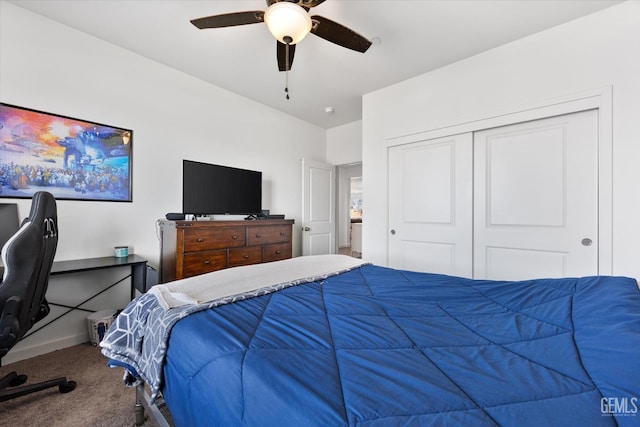 carpeted bedroom featuring a closet and ceiling fan