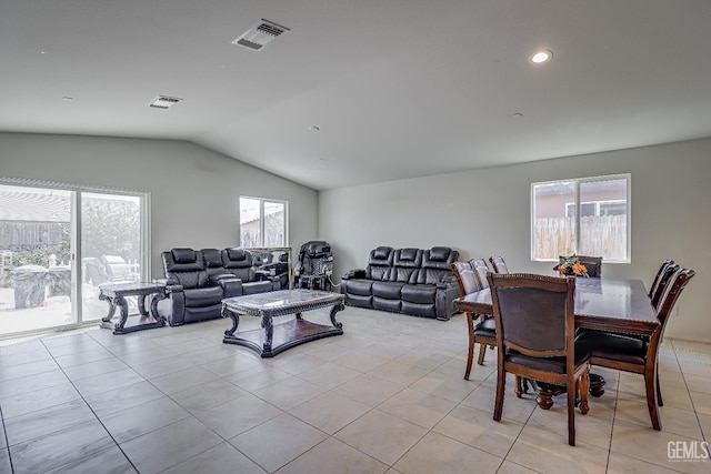 615 Welch Ave, Bakersfield, CA 93307 - living area with light tile patterned flooring, vaulted ceiling, healthy amount of natural light, and recessed lighting