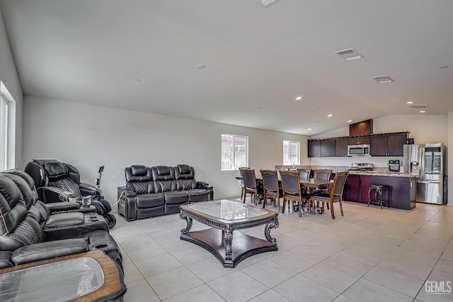 615 Welch Ave, Bakersfield, CA 93307 - living room with vaulted ceiling, light tile patterned floors, and recessed lighting