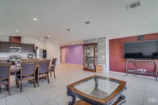 615 Welch Ave, Bakersfield, CA 93307 - living area featuring light tile patterned flooring, recessed lighting, and vaulted ceiling