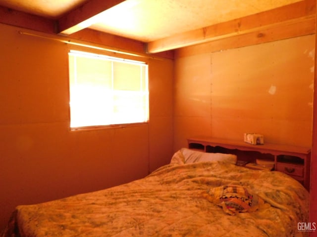 bedroom with beamed ceiling