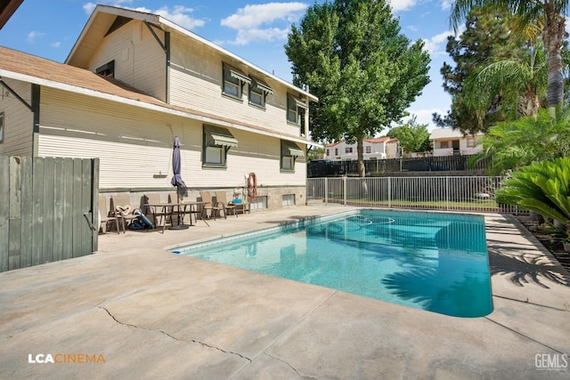 view of swimming pool featuring a patio area