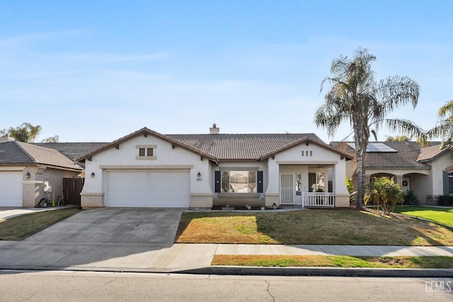 ranch-style house featuring a garage, a front lawn, and a porch