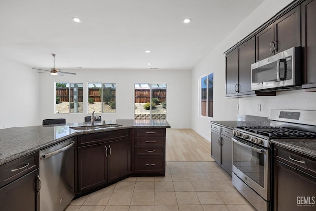 9702 Petersburg Pl, Bakersfield, CA 93306 - kitchen featuring appliances with stainless steel finishes, a sink, dark brown cabinets, recessed lighting, and a ceiling fan