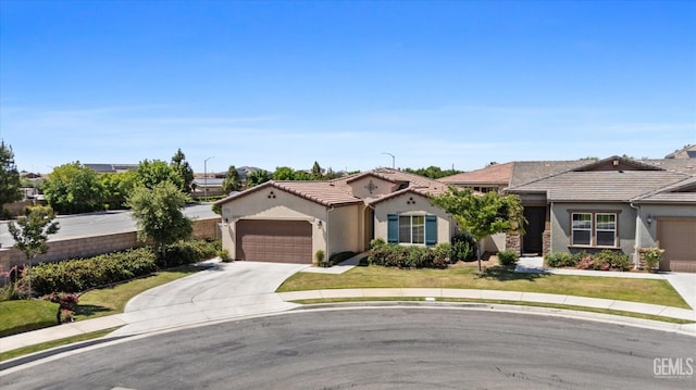 9702 Petersburg Pl, Bakersfield, CA 93306 - view of front of home featuring stucco siding, an attached garage, concrete driveway, and a tile roof