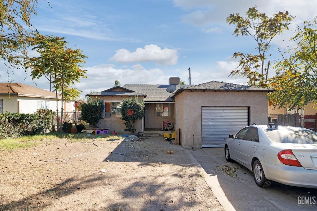 ranch-style home featuring a garage